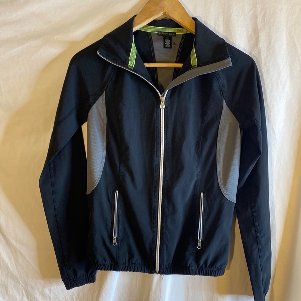 Woman’s zip up lightweight athletic coat size XS